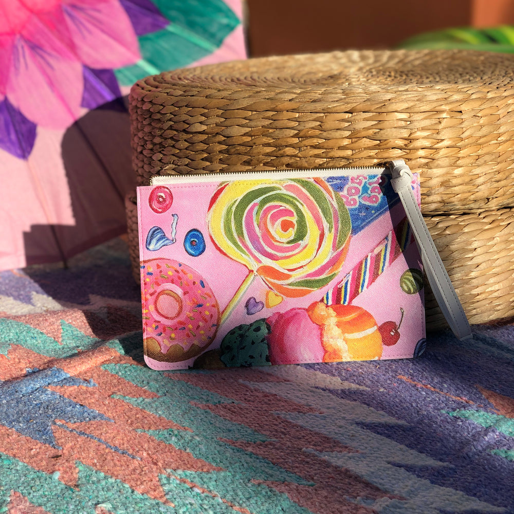 Back view of the clutch with a colorful candy artwork print.