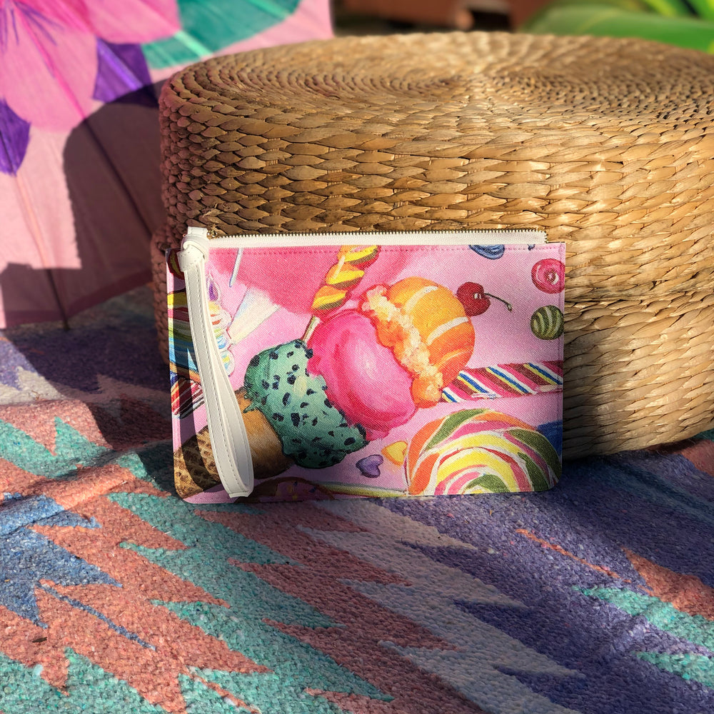 Front view of the clutch with a vibrant candy artwork print.