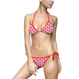 hot cherries pattern on pink background swimsuit with red elastic band front view 