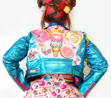 blue punk biker jacket made of iridescent shiny synthetic fabric with hot pink zippers rainbow chain and patches eat me and lick me until ice cream candy artwork on canvas print on back with muffins ice cream lolly pop and donut 