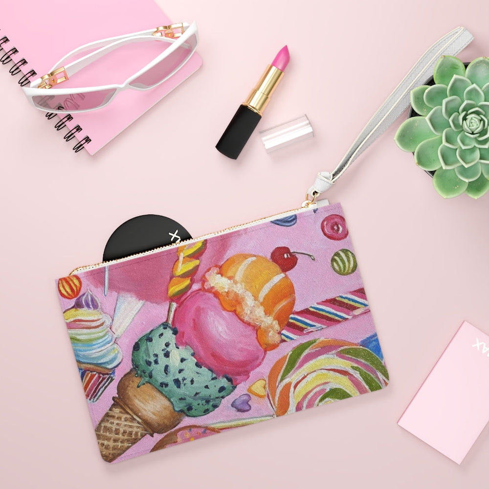 bag with artwork of ice cream, cup cake, lollipop, candy in the front. Fits Make-Up, Sunglasses or power bank.