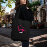 Model showing the back side of the kinky peach bag with Freaky Iconic Logo in San Francisco